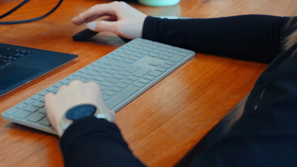 Genesis Evolution office where Kiara's hand is typing